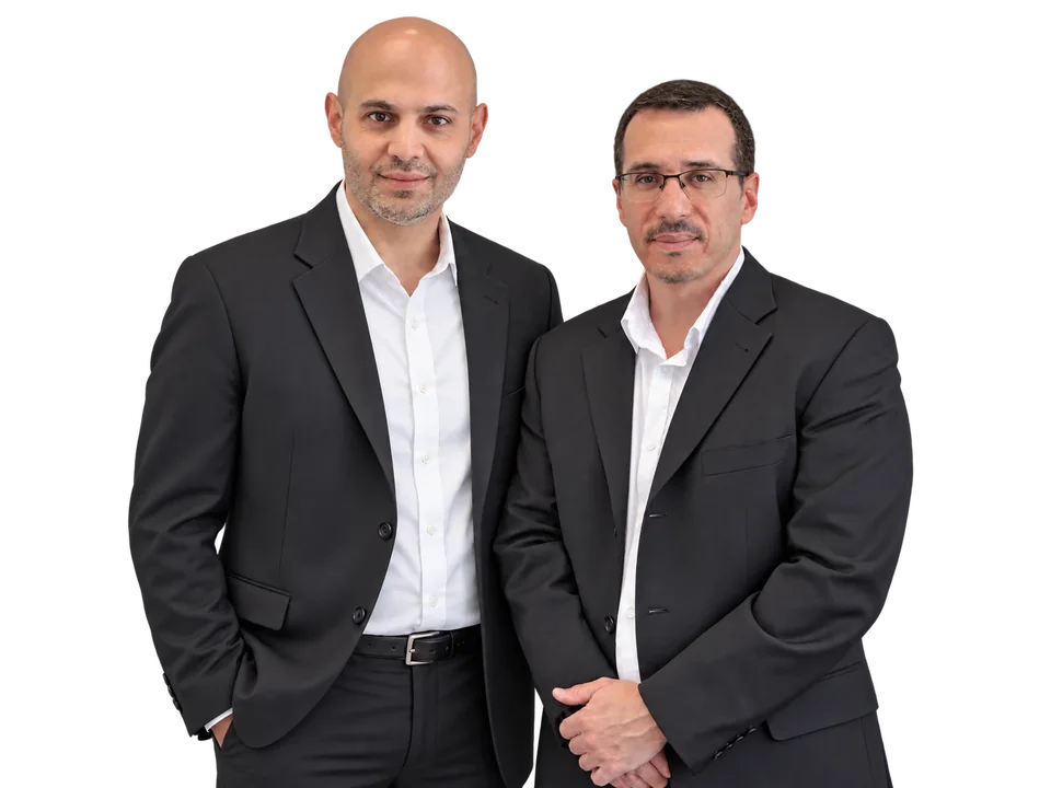 עו״ד אורי דלאל ועו״ד טל כהן, השותפים במשרד